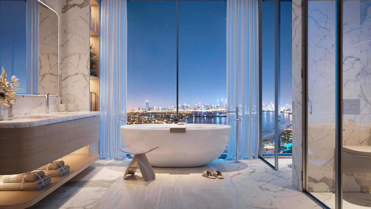 BELLA by PASSO — marble bathroom with skyline view at dusk