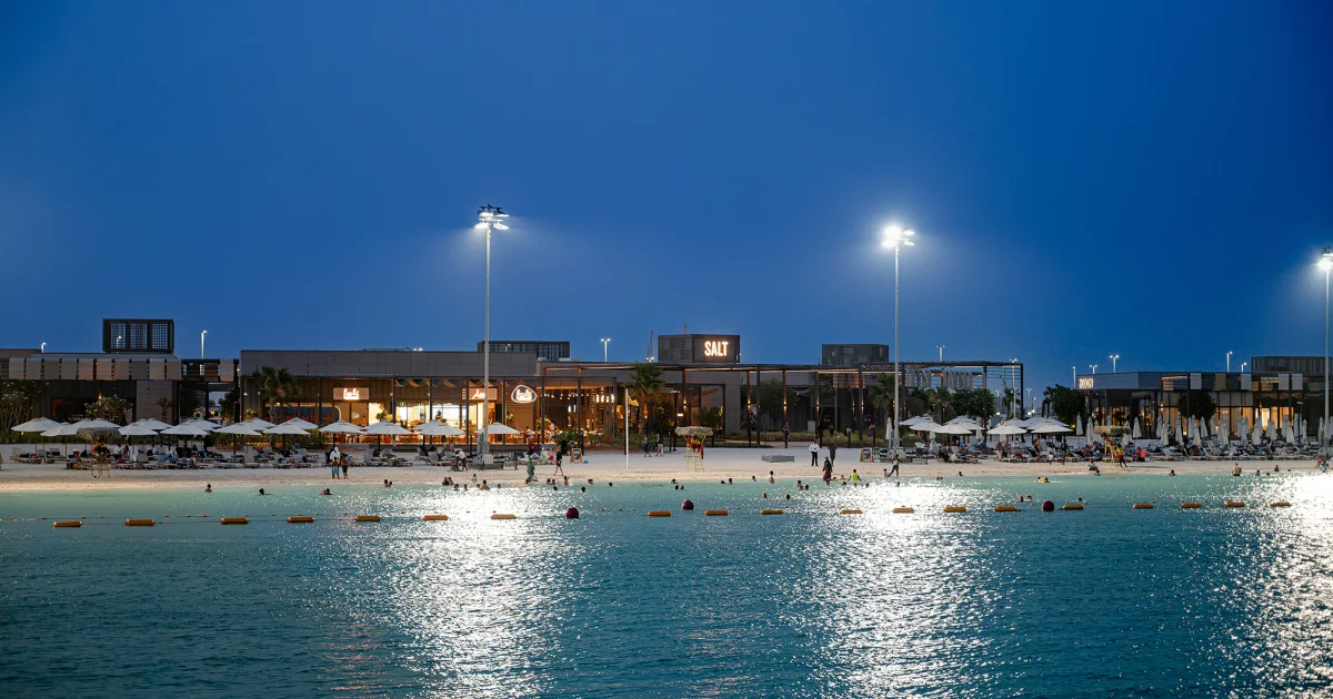 Marsana Beach illuminated evening promenade and coastal dining on Hudayriyat Island Abu Dhabi