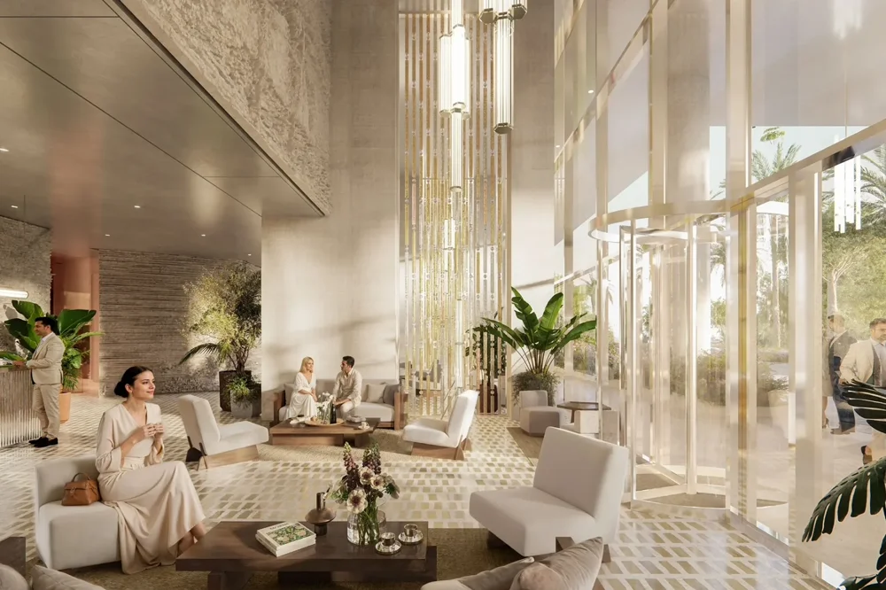 Grand double-height entrance lobby with 24/7 concierge at Riviera Residences