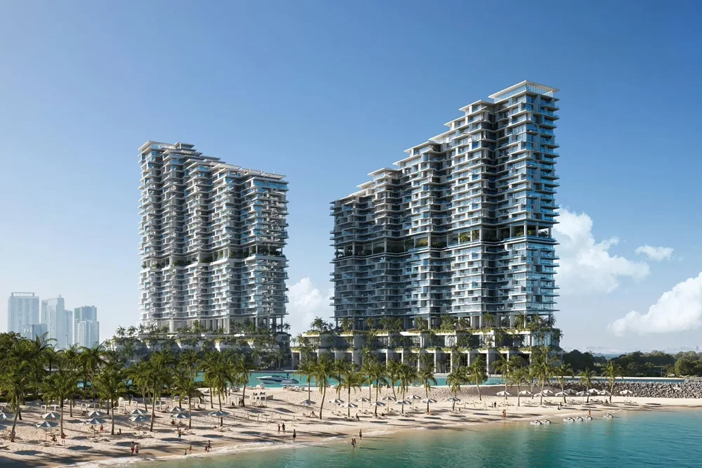 Mother-of-pearl façade by Herzog & de Meuron reflecting sunlight and Gulf waters